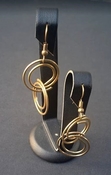 Fashion gold colored round double swirl dangle fishhook earrings
